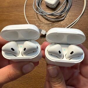 2 Apple AirPods Great Condition With 2 Charging Cords And Charging Port